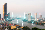 Fototapeta Nowy Jork - Social media icons hologram over panorama city view of Bangkok, Asia. The concept of people networking and connections. Double exposure.