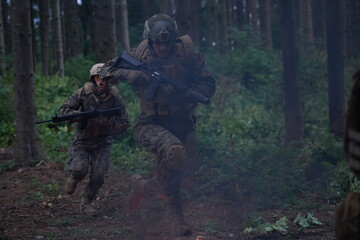 Soldier in Action at Night jumping over fire