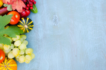  Seasonal fruits and vegetables on blue background. Autumn harvest.