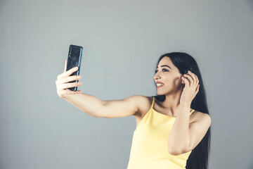 Wall Mural - woman holding phone and selfie