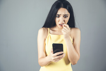 Wall Mural - scared woman holding phone