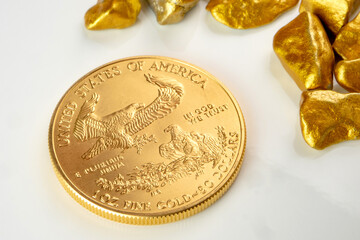 golden american eagle one ounce coin laying on a heap of golden nuggets, golden ore