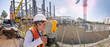 © LRafael - Topographical survey engineer in a building projectPanoramic view of a huge construction site