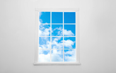 Wall Mural - beautiful view on blue sky with clouds through window