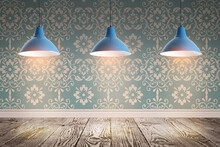 Blue Patterned Wallpaper And Glowing Hanging Lamps In Room