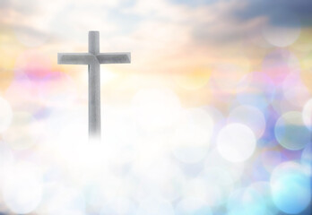 Wall Mural - Wooden cross with bokeh blur background