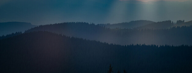 Wall Mural - the sun's rays breaking through the clouds