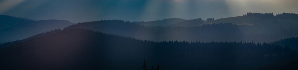 Wall Mural - the sun's rays breaking through the clouds