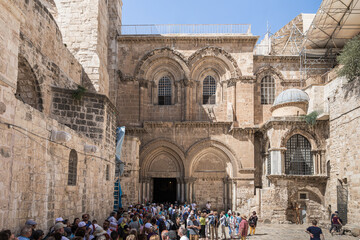 Numerous tourists stand at the entrance to the Holy Sepulchre in the Old City in Jerusalem, Israel