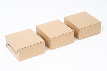 Wall Mural - Brown paper box for food package. carton on a white background.