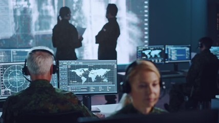 Fototapete - Shifting Focus Between Military Surveillance Officers Working in a Central Office Hub for Cyber Operations, Control and Monitoring for Managing National Security, Technology and Army Communications.