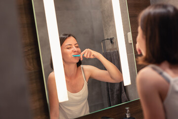 Woman brushing her teeth