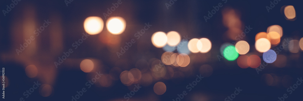Night city lights, blurred image with bokeh and highlights, panorama banner format - obrazy, fototapety, plakaty 