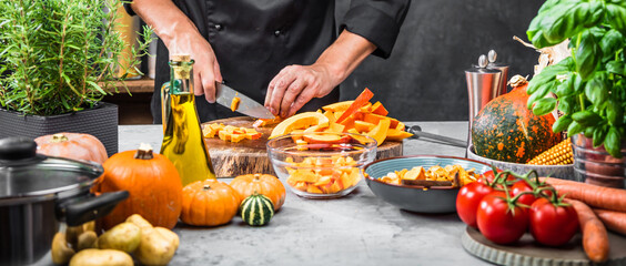 chef chopping pumpkins for pumpkin soup