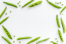 Frame Of Green Pea Pods And Peas On The Kitchen Background