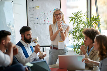 Young woman leading business meeting