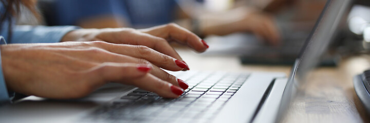 Woman in office is typing on keyboard. Learning new professions online concept