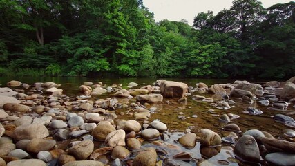 Wall Mural - A scenic view of the cascading waterfalls of the River Swale at Richmond,North Yorkshire,England, UK