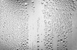© Leohoho - Water drops on glass surface. Droplets black and white background