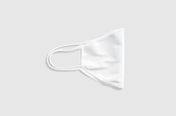 Poster - Blank white fabric folded face mask mockup lying, gray background