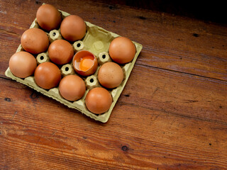 Wall Mural - Eggs in an egg cup, on a wooden table