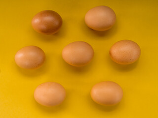 Wall Mural - Eggs on a yellow background