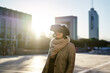 © Per Swantesson/Stocksy - Young woman using a VR headset outdoors