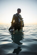 © TONY MYSHLYAEV/Stocksy - Diver Wading in Water