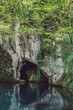 © Lumina/Stocksy - Natural Cave and Lake