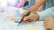 © Chan2545 - Background of teamwork professional business man woman work on conference meeting discuss plan consult advice sale economic marketing strategy share idea presenting with graph document in the office