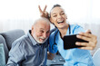 © Lumos sp - nurse doctor senior care selfie caregiver help  retirement home mobile phone smartphone cell