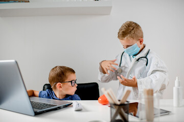 Two boys are playing doctor,