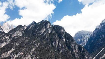 Wall Mural - Time Lapse of mountain landscape with moving clouds