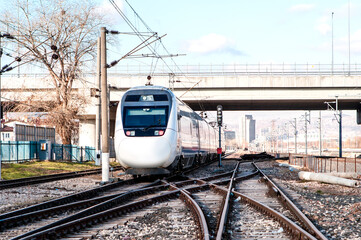 Wall Mural - High speed train runs on rail tracks . Train in motion