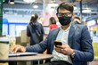 © tuiphotoengineer - Asian businessmen are talking on the phone and using note book for working ,he wearing mask for protect coronavirus