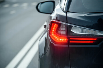 Rear Stop Light Of Large Suv Black Car