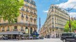 Romantic cozy view of the famous Eiffel tower from a small paris street on a cloudy sunny day in spring summer - wide horizontal panorama, traffic in motion blur.Camera fixed position