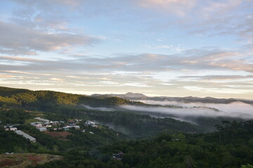 Wall Mural - dramatic sky and clouds on the mountains at sunrise