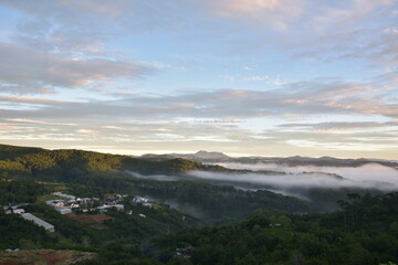 Wall Mural - dramatic sky and clouds on the mountains at sunrise