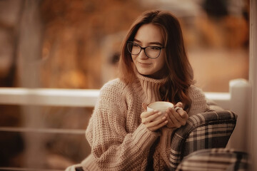 Wall Mural - happy girl autumn cafe sweater concept vision model with glasses posing