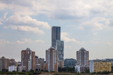 Fototapeta Miasto - view of modern residential buildings against a cloudy sky and space for copying in Moscow Russia