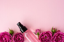 Pink Skin Tonic In A Plastic Bottle With Rose Flowers