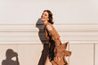 © Look! - Excited spectacular woman posing in warm september day. Outdoor shot of laughing brown-haired girl in vintage dress.