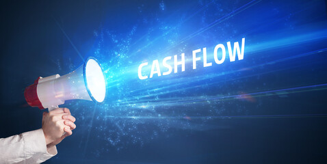 Young person shouting in loudspeaker with CASH FLOW inscription, business concept