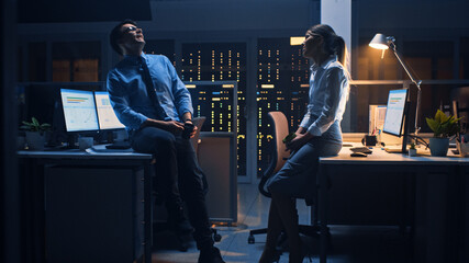 Poster - Late at Night in the Corporate Office Two Young Professionals Chatting Friendly, Exchanging News, Talking about Job, Flirting