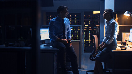 Poster - Late at Night in the Corporate Office Two Young Professionals Chatting Friendly, Exchanging News, Talking about Job, Flirting