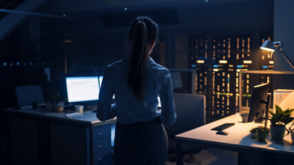 Poster - Back View Shot of Businesswoman Walking in Corporate Office to Take Her Place at Desktop Computer and Proceed Working on Important Project