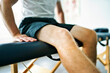 © Louis-Paul Photo - A Modern rehabilitation physiotherapy place with man client sit on table