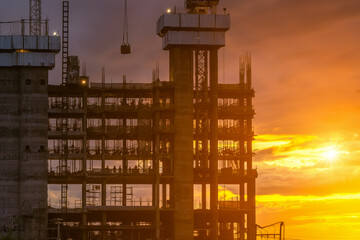 Silhouette construction industry  worker team to work safety on high ground over blurred background sunset pastel.