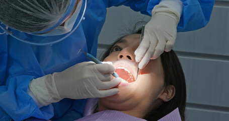 Poster - Woman undergo dental scaling treatment